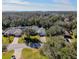 Aerial view of a residential neighborhood with tree-lined streets at 10108 Silver Bluff Dr, Leesburg, FL 34788