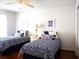 Twin bedroom with navy and white bedding at 10108 Silver Bluff Dr, Leesburg, FL 34788