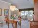 Elegant dining room with hardwood floors and natural light at 10108 Silver Bluff Dr, Leesburg, FL 34788