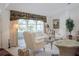 Spacious living room with arched windows and light colored furniture at 10108 Silver Bluff Dr, Leesburg, FL 34788