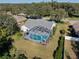 Aerial view of a refreshing pool and surrounding landscape at 10108 Silver Bluff Dr, Leesburg, FL 34788