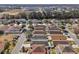 Aerial view of houses in a residential neighborhood, showing street and lot sizes at 12306 Ne 48Th Way, Oxford, FL 34484