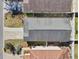 Aerial view of a house showing the roofline, yard, and driveway at 12306 Ne 48Th Way, Oxford, FL 34484