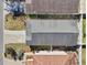 A direct aerial view of the property showing the roof, driveway, and backyard at 12306 Ne 48Th Way, Oxford, FL 34484