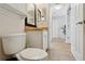 Small bathroom with toilet and vanity at 12306 Ne 48Th Way, Oxford, FL 34484