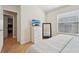 Bright bedroom with natural light, a large dresser, and a comfortable bed at 12306 Ne 48Th Way, Oxford, FL 34484
