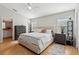 Bright bedroom features wood floors and a plush bed at 12306 Ne 48Th Way, Oxford, FL 34484