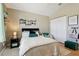 Cozy bedroom featuring wood floors and a cushioned chair at 12306 Ne 48Th Way, Oxford, FL 34484