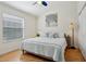 Bedroom featuring a queen bed, window and closet at 12306 Ne 48Th Way, Oxford, FL 34484