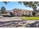 Exterior view of a community center with stone accents and ample windows at 12306 Ne 48Th Way, Oxford, FL 34484