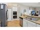 Modern kitchen with stainless steel appliances and light-colored cabinetry at 12306 Ne 48Th Way, Oxford, FL 34484