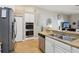 Well-appointed kitchen showcasing built-in appliances, modern cabinetry, and a functional layout for cooking at 12306 Ne 48Th Way, Oxford, FL 34484