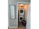 Efficient laundry closet with stacked washer and dryer at 12306 Ne 48Th Way, Oxford, FL 34484