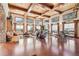 A spacious lounge area with hardwood floors, large windows and comfortable seating at 12306 Ne 48Th Way, Oxford, FL 34484