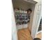 A fully stocked pantry with ample shelving providing plenty of storage space for all your food and kitchen needs at 12306 Ne 48Th Way, Oxford, FL 34484