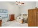 Spacious bedroom with king-size bed, dresser, and plenty of natural light at 1381 Winterville St, Deltona, FL 32725