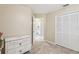 Bedroom with white dresser and access to a bathroom at 1381 Winterville St, Deltona, FL 32725