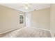 Bright bedroom with neutral walls, carpet, and ceiling fan at 1381 Winterville St, Deltona, FL 32725