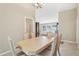 Dining room with light wood table and six chairs at 1381 Winterville St, Deltona, FL 32725