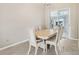 Dining room features a table, six chairs, and sliding doors to a patio at 1381 Winterville St, Deltona, FL 32725