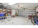 Attached garage with storage shelving and space for vehicles at 1381 Winterville St, Deltona, FL 32725