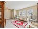 Living room with sofa, chairs, and a red rug at 1381 Winterville St, Deltona, FL 32725