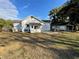 Large backyard with patio and detached building at 13920 S Highway 25, Eastlake Weir, FL 32133