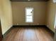 Bright bedroom with hardwood floors and large window at 13920 S Highway 25, Eastlake Weir, FL 32133