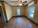 Well-lit bedroom with hardwood floors and a large window at 13920 S Highway 25, Eastlake Weir, FL 32133