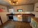 Updated kitchen with stainless steel appliances and a farmhouse sink at 13920 S Highway 25, Eastlake Weir, FL 32133