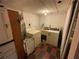 Basement laundry room with washer and dryer hookups at 13920 S Highway 25, Eastlake Weir, FL 32133