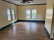 Bright living room featuring hardwood floors and multiple windows at 13920 S Highway 25, Eastlake Weir, FL 32133