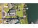 Aerial view of a luxury home with solar panels and private dock at 1535 Sunset Cir, Mount Dora, FL 32757