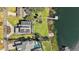 Aerial view of a luxury home with solar panels and private dock at 1535 Sunset Cir, Mount Dora, FL 32757