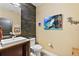 Modern bathroom with stone feature wall and contemporary fixtures at 1535 Sunset Cir, Mount Dora, FL 32757