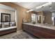 Elegant bathroom with double vanity and built-in bench at 1535 Sunset Cir, Mount Dora, FL 32757