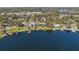 Aerial view of lakefront community with many homes at 1535 Sunset Cir, Mount Dora, FL 32757