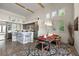 Bright dining room with wooden table and chairs, near kitchen at 1535 Sunset Cir, Mount Dora, FL 32757