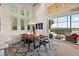 Modern dining room with sliding doors to screened patio and lake view at 1535 Sunset Cir, Mount Dora, FL 32757