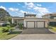 Modern two-story home with two-car garage and attractive landscaping at 1535 Sunset Cir, Mount Dora, FL 32757