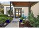 Inviting front porch with seating area and colorful landscaping at 1535 Sunset Cir, Mount Dora, FL 32757