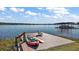 Private lake dock with kayaks and paddleboard at 1535 Sunset Cir, Mount Dora, FL 32757