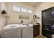 Laundry room with washer, dryer, and sink at 1535 Sunset Cir, Mount Dora, FL 32757