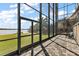 Spacious screened patio overlooking lake with paver stones and seating area at 1535 Sunset Cir, Mount Dora, FL 32757