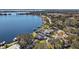 Wide aerial view of lakefront home and neighborhood at 1535 Sunset Cir, Mount Dora, FL 32757