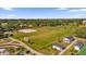 Aerial view of a community park with sand volleyball, soccer field, and pavilions at 16967 Se 93Rd Cuthbert Cir, The Villages, FL 32162