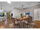 Bright dining room with wood flooring and a view into the living room at 16967 Se 93Rd Cuthbert Cir, The Villages, FL 32162