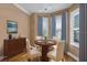 Cozy dining nook with elegant table, chairs, and natural light at 16967 Se 93Rd Cuthbert Cir, The Villages, FL 32162