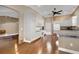 Bright kitchen with white cabinets, hardwood floors and modern appliances at 16967 Se 93Rd Cuthbert Cir, The Villages, FL 32162