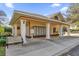 Exterior shot of neighborhood post office box area with a yellow roof and white columns at 16967 Se 93Rd Cuthbert Cir, The Villages, FL 32162